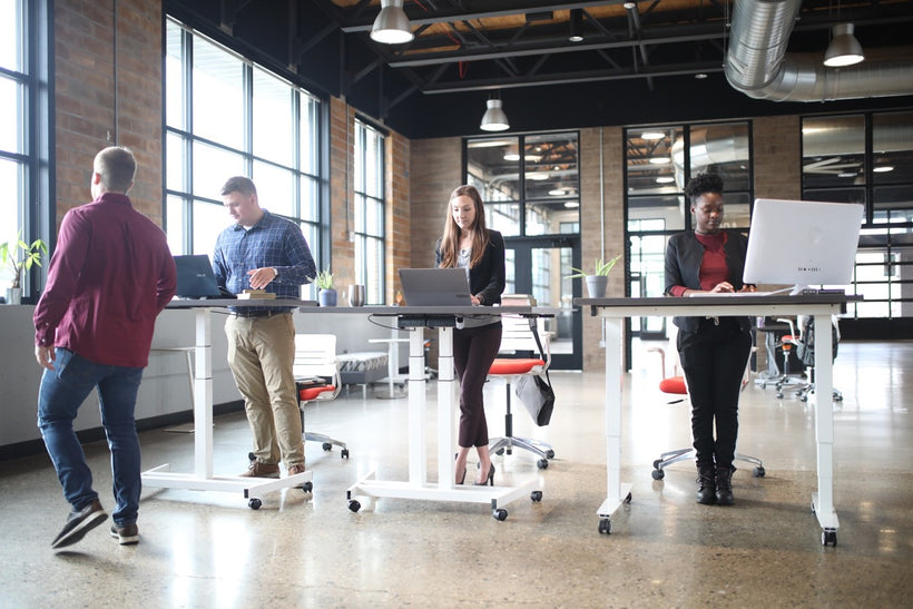 How do standing desks enhance your office furniture?